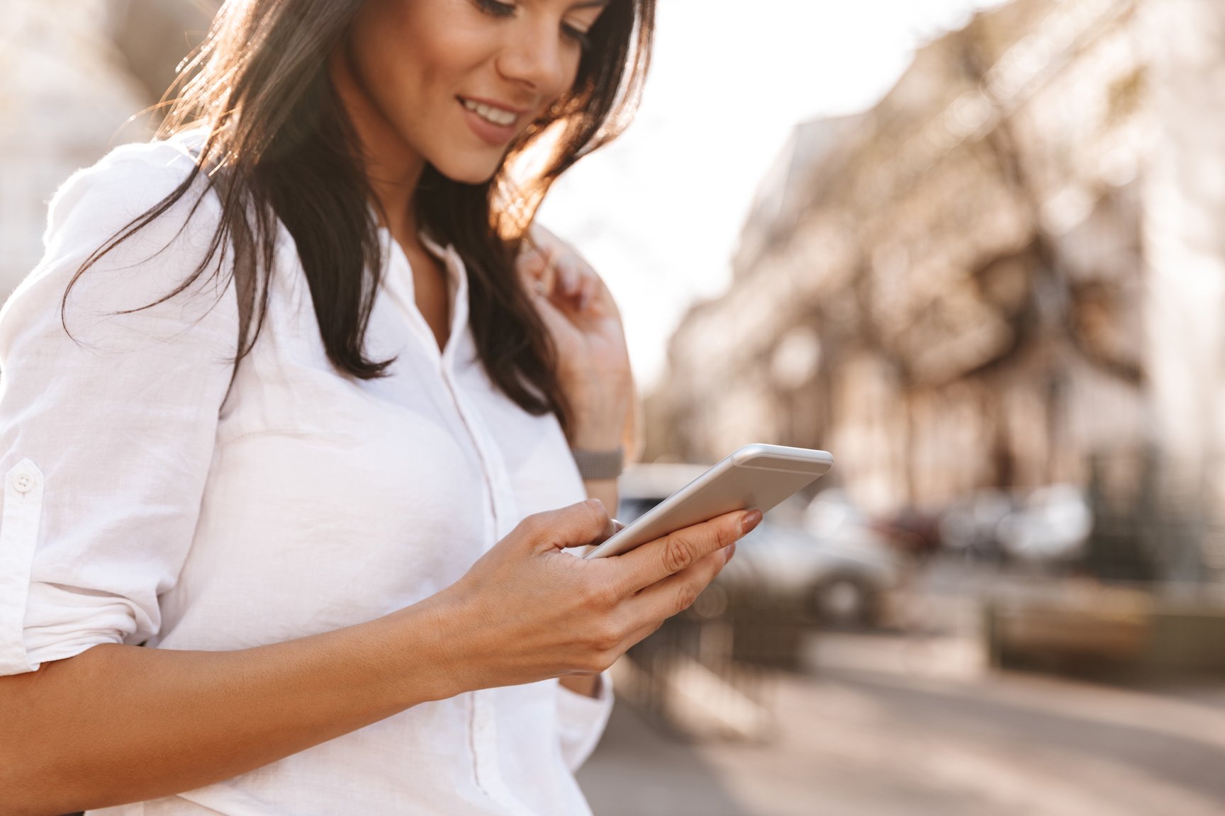 Woman with Phone Outdoors